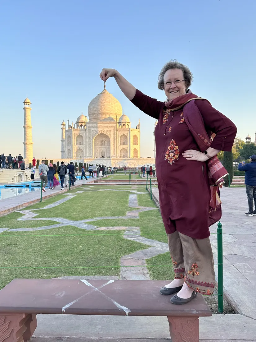 A guest striking the classic Taj Mahal photo pose