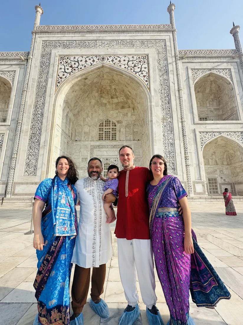 Family in traditional dress at the Taj Mahal