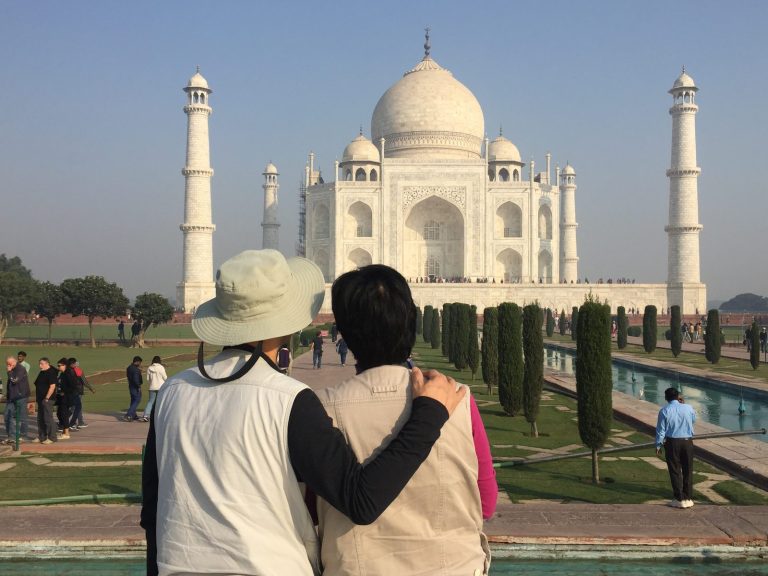 Two travellers looking at the Taj Mahal for the first time, Agra
