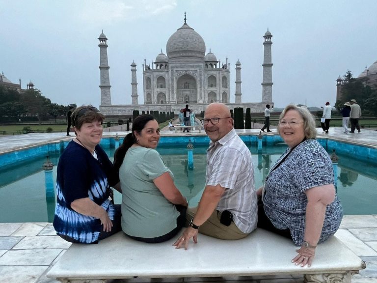 A small private group of travellers at the Taj Mahal reflecting pool, Agra
