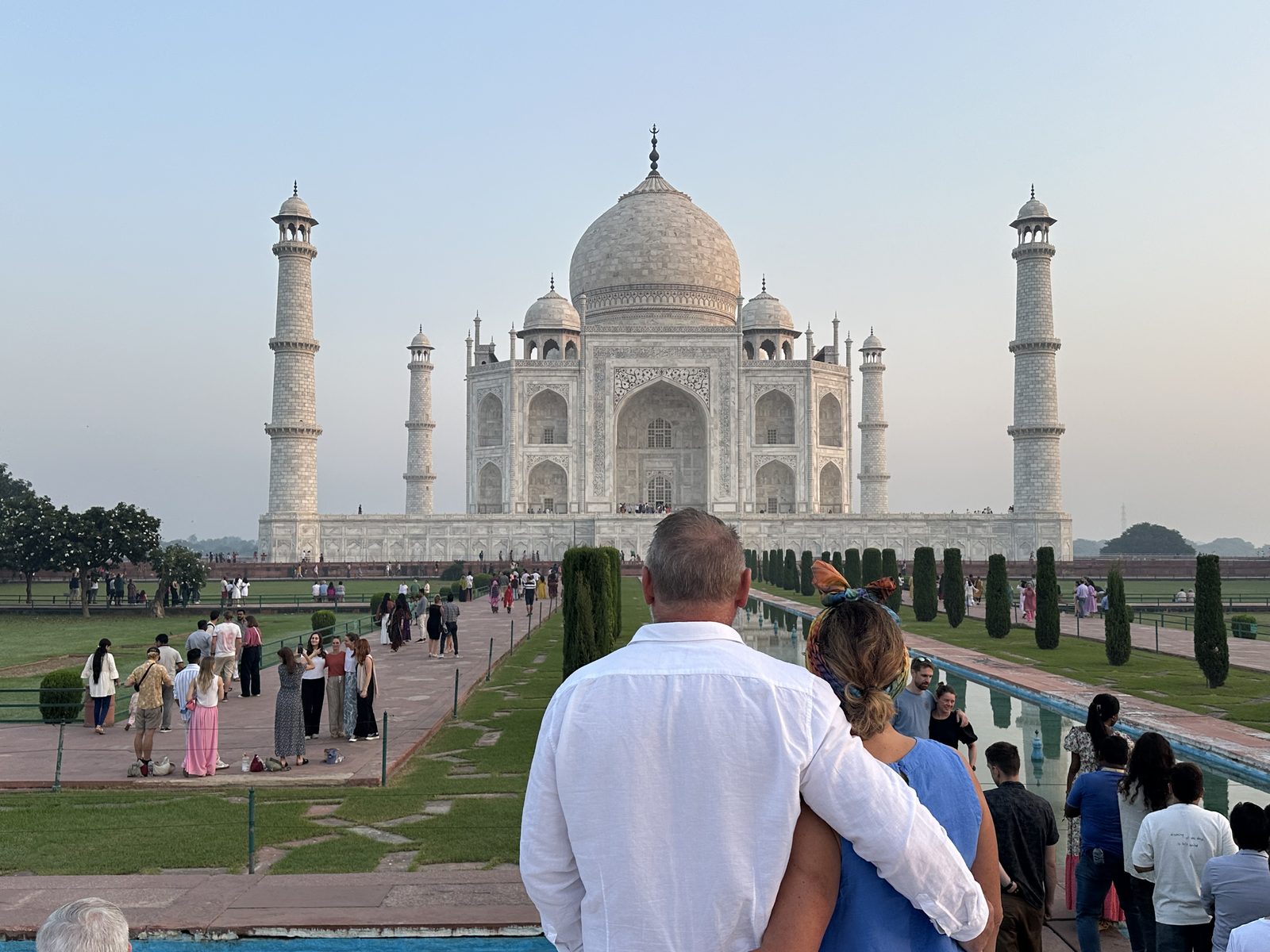 Travelers at the Taj Mahal at first light during the cool season in Agra