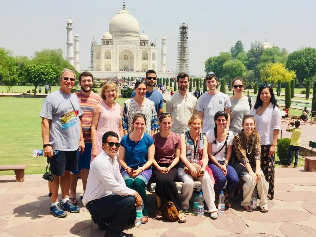 A tour group on the entry lawns in front of the Taj Mahal in Agra